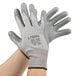 A pair of small Cordova HPPE gloves with gray polyurethane palm coating.