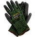 A pair of Cordova Monarch green and black work gloves with a label.