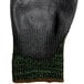A pair of black Cordova Monarch cut-resistant gloves with green stripes.
