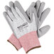 A pair of Cordova extra small cut-resistant work gloves with gray polyurethane coating.