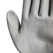 A pair of Cordova Monarch small gray cut-resistant gloves with gray polyurethane palm coating.