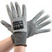 A pair of small Cordova Monarch gray gloves with a black wrist label.