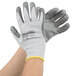 A pair of small Cordova cut-resistant gloves with gray palm coating and yellow trim.