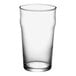 An Acopa Select English pub glass filled with a clear liquid on a white background.