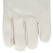 A close up of a white Cordova leather welder's glove with yellow thread.