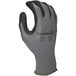 A close-up of a Cordova Conquest gray nylon/spandex glove with black micro-foam nitrile/polyurethane palm coating.