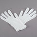 A pair of white Cordova Men's inspection gloves.