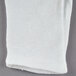 A folded white Cordova heavy weight fabric glove.