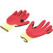 A pair of Cordova yellow and red heavy duty work gloves with yellow and red palm coating.