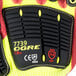 A pair of yellow and black Cordova OGRE-CR+ gloves with red sandy nitrile coating and TPR reinforcements.