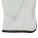 A white Cordova cowhide driver's glove with brown stitching.
