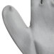 A close up of a Cordova gray nylon glove with a gray palm coating.