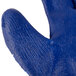 A small blue and white Cordova work glove with blue latex on the palm.