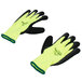 A pair of yellow and black Cordova warehouse gloves with green foam latex palms.