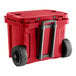 A red CaterGator outdoor cooler with black wheels.