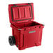 A red CaterGator outdoor cooler with black handles and wheels.