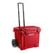 A red CaterGator outdoor cooler with black handles and wheels.