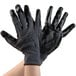 A pair of black and gray Cordova work gloves with black nitrile palms.