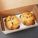 A Baker's Mark cupcake and muffin insert holding two muffins in a box.