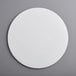 A white circle with a textured surface.
