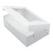 A white bakery box with a clear window on the lid, partially open and designed for cakes or baked goods.