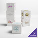 A group of white Baker's Lane cupcake boxes with logos on them.
