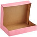 A pink Baker's Mark bakery box with the lid open.