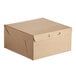 A brown Baker's Mark cake box with a lid.