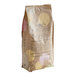 A brown bag of Valrhona Raspberry Inspiration Couverture Feves with text and images.