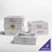 A group of Baker's Lane white bakery boxes with customizable windows.