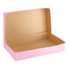 A pink Baker's Lane bakery box with a lid open.