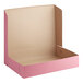 A pink Baker's Mark bakery box with the lid open on a white background.