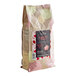 A bag of Valrhona Strawberry Inspiration Couverture Feves with a label on a white background.