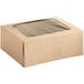 A Baker's Mark brown cardboard bakery box with a clear window.