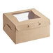 A Baker's Mark brown cardboard bakery box with a clear window.