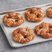 A tray of Kim & Scott's Pizza Stuffed Soft Pretzels on a gray surface.