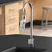 A Delta laboratory faucet with a chrome finish on a countertop.