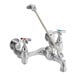 A silver Delta mop sink faucet with dual cross-style handles.