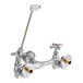 A silver Delta faucet with dual cross-style handles.