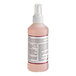 A close-up of a pink Noble Chemical container with a white label.