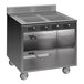 A Spring USA stainless steel mobile induction cooking cart with 4 ranges and 2 drawers.