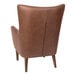 A brown leather Flash Furniture wingback accent chair with wooden legs.