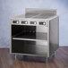 A stainless steel Spring USA induction cooking cabinet with four ranges.