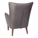 A Flash Furniture Connor dark gray faux leather wingback accent chair with wooden legs.