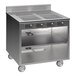 A Spring USA stainless steel mobile induction cooking cart with 4 ranges.