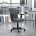 A Flash Furniture gray mid-back office chair with armrests and a black base and wheels.