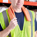 A man wearing a safety vest and Lavex orange cooling towel around his neck.