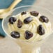 Dark chocolate covered dried cherries in a bowl.