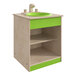 A green and white wooden children's play sink with a shelf.