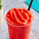 A glass of Shirley Temple made with I. Rice Shirley Temple Water Ice Base.